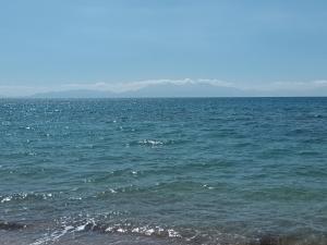 a large body of water with mountains in the background at Villa Despina in Nea Iraklia