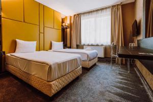 Postel nebo postele na pokoji v ubytování HOTEL CIAO