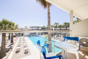 a view of the pool from the balcony of a resort at Cameo Beach Resort in Laganas