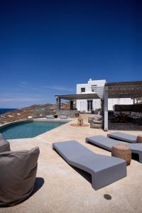 a resort with a swimming pool and a villa at Cabana Seaview Pool Villas near Alemagou beach in Ftelia