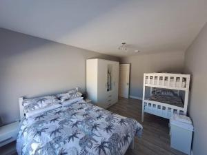 Postel nebo postele na pokoji v ubytování Tranmore Lodge