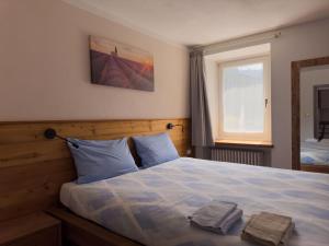 Postel nebo postele na pokoji v ubytování Appartamenti LITEGOSA casa vacanza 1