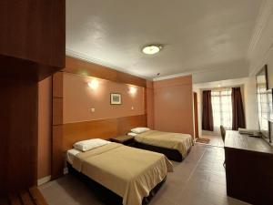 Letto o letti in una camera di Cool Point Hotel