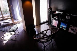 Телевізор і / або розважальний центр в Ryokan KINOSUKE hotel きの助 日間賀島 島のサウナ Himaka Island