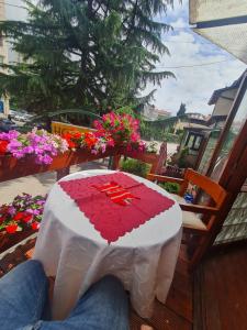 a table with a heart on top of it at Hotel Kapistec Skopje in Skopje