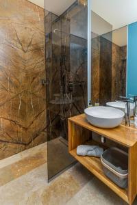 a bathroom with a sink and a shower at Astria Brasil - Complex Novum in Olimp +39 photos