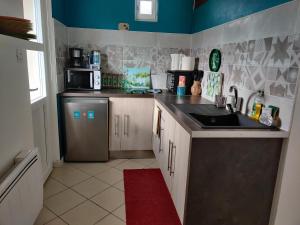 Kuchyň nebo kuchyňský kout v ubytování Studio Belle Vue