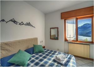 Postel nebo postele na pokoji v ubytování Casa Vacanza alla Curva + 12 fotografií