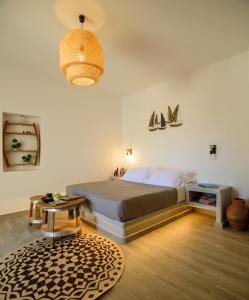 Postel nebo postele na pokoji v ubytování Athiri Luxury Suites
