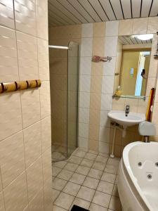 a bathroom with a shower and a sink at Comfortable apartament to stay in Tallinn in Tallinn