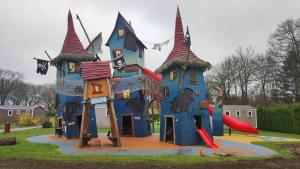 a play structure in the shape of a house at Poort van de Veluwe in Voorthuizen