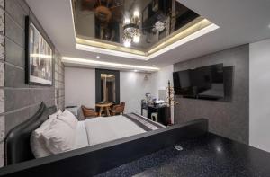 Postel nebo postele na pokoji v ubytování Hotel Cube