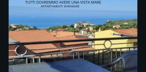 a view of the ocean from a balcony at Appartamenti Miramare in Marina di Camerota