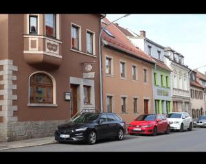 a group of cars parked on the side of a street at Zum Gogerer in Floß