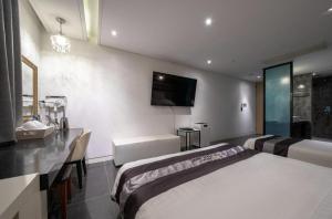 Postel nebo postele na pokoji v ubytování Hotel Cube