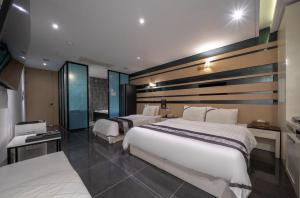 Postel nebo postele na pokoji v ubytování Hotel Cube