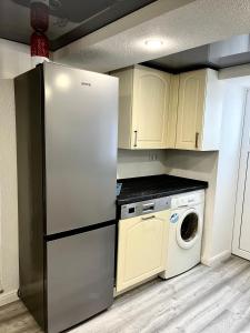 Kuchyň nebo kuchyňský kout v ubytování Linger House