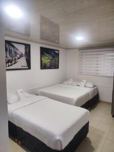 Giường trong phòng chung tại Hospedaje Entre Líneas +2 ảnh