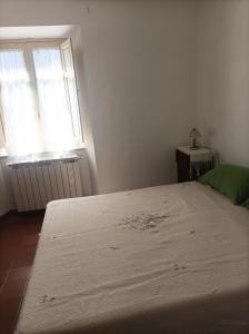 Postel nebo postele na pokoji v ubytování Nonno Fedè