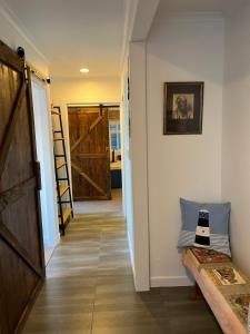 a hallway with a door leading to a room at Pacific Ocean House seafront 3bd2bh near airport in Wellington