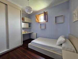 Postel nebo postele na pokoji v ubytování Precioso apartamento en O Grove
