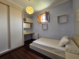 Postel nebo postele na pokoji v ubytování Precioso apartamento en O Grove