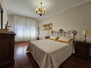 Postel nebo postele na pokoji v ubytování Precioso apartamento en O Grove