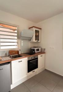Kuchyň nebo kuchyňský kout v ubytování Logement PALMIER + 5 fotografií