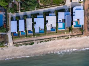 an aerial view of a building next to the water at Sunshine Paradise Resort in Ban Krut