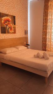 Postel nebo postele na pokoji v ubytování Hotel Riviera