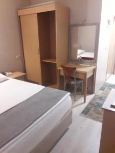 A bed or beds in a room at OTEL AMİLLER
