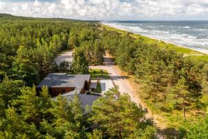 an aerial view of a house next to the beach at 50 meters to the Sea in Juodkrantė