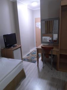A television and/or entertainment centre at OTEL AMİLLER