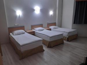 A bed or beds in a room at OTEL AMİLLER