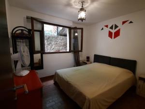 Postel nebo postele na pokoji v ubytování Vacancorse Maison U Canale