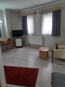 A television and/or entertainment centre at OTEL AMİLLER