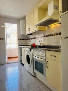 a kitchen with a stove and a dishwasher at Casa Pepa by Sun & Sea Homes in Moraira +12 photos