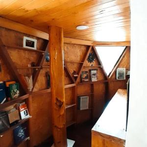 an inside view of a room with a wooden ceiling at Glamping Ibanazk in Ibagué