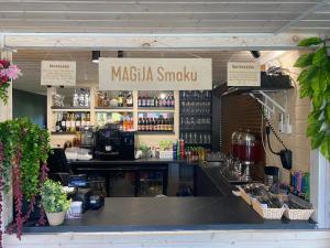 a bar with a sign that reads magica snkush at Magija Bałtyku in Sarbinowo