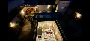 an overhead view of a building at night with lights at Riad Magnolia & SPA in Marrakech