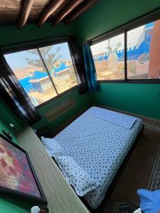 Giường trong phòng chung tại Taddart Aglou