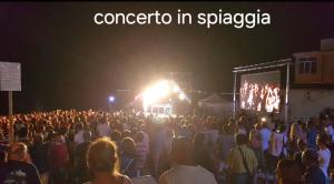 a crowd of people standing in front of a stage at VISTA MARE SAVONA in Savona