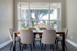 a dining room with a table and chairs and a window at Santa Clara 1BR w Spa Pool AC in downtown SFO-847 in Santa Clara