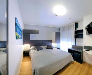 Postel nebo postele na pokoji v ubytování Hotel Panorama