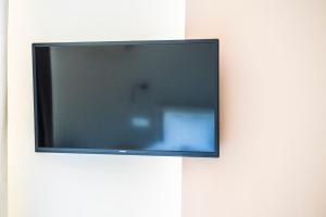 a flat screen tv hanging on a wall at MARIVAL Luxury Living - Adults Only in Sivota