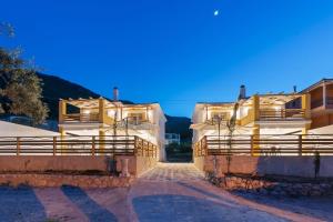 a couple of buildings with lights on them at Sea La Vie in Nikiana