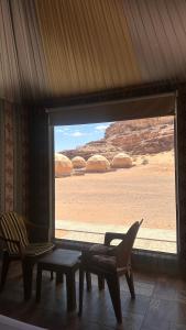 a room with a window looking out at the desert at Rum desert magic in Wadi Rum