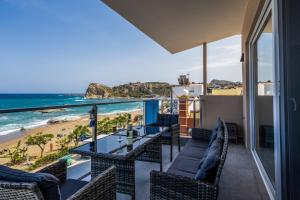 a balcony with a view of the beach at Stegna Sea & Sun in Archangelos