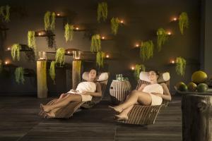 a man and a woman sitting in chairs at Hotel Excelsior - Liburnia in Lovran