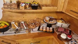a table with a bunch of different types of food at B&B Casa Nostra in Caderzone Terme